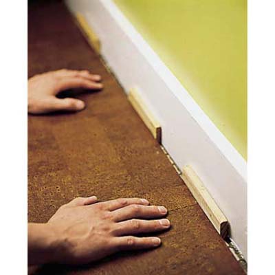 Inserting spacers along the wall.