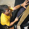 Tom Silva installing a window