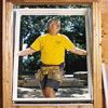Tom Silva installing a window