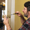 Norm Abram installing the latch assembly and knob of a lockset