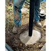 Setting the post into the concrete footing