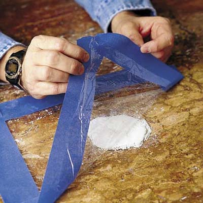 covering the wet poultice with plastic wrap