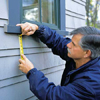 Tom Silva marking the mounting location of a window box