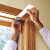 inserting a thin wood shim when installing a window shade