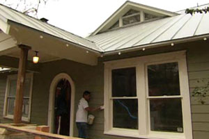 working on an exterior window at the Austin house project