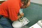 Richard Trethewey shows how to install a dual-flush toilet