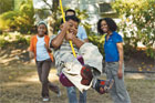 Child swinging on handmade, old-fashioned tree swing