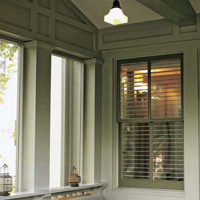Trim with square columns and exposed beams and reproduction pendant light 