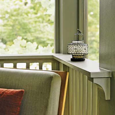 The top rail's deep ledge is supported by curved bracket details

