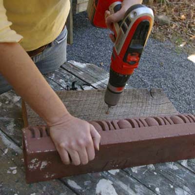 pre-drill holes for screws to turn cornice into garden tool holder