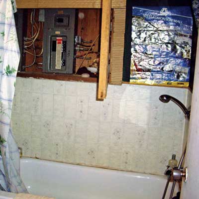 shower head installed below a circuit breaker panel  from home inspection nightmares gallery twenty-seven