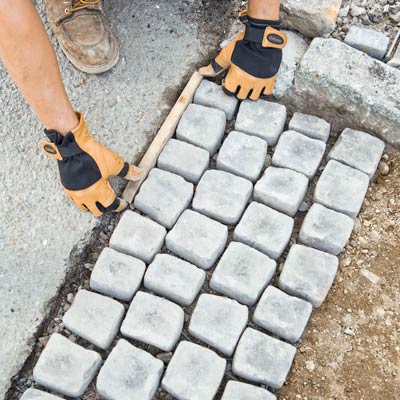 Begin Laying the Cobblestone Mats | How to Build a Driveway Apron ...